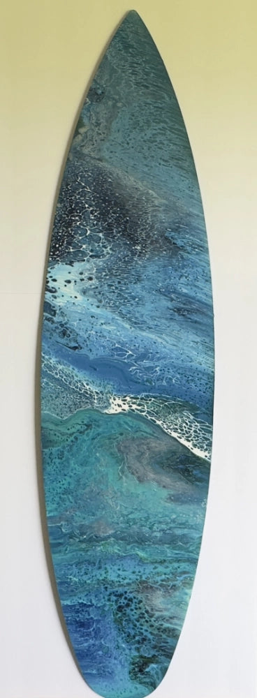 Decorative surfboard with blue and green abstract pattern on a white background